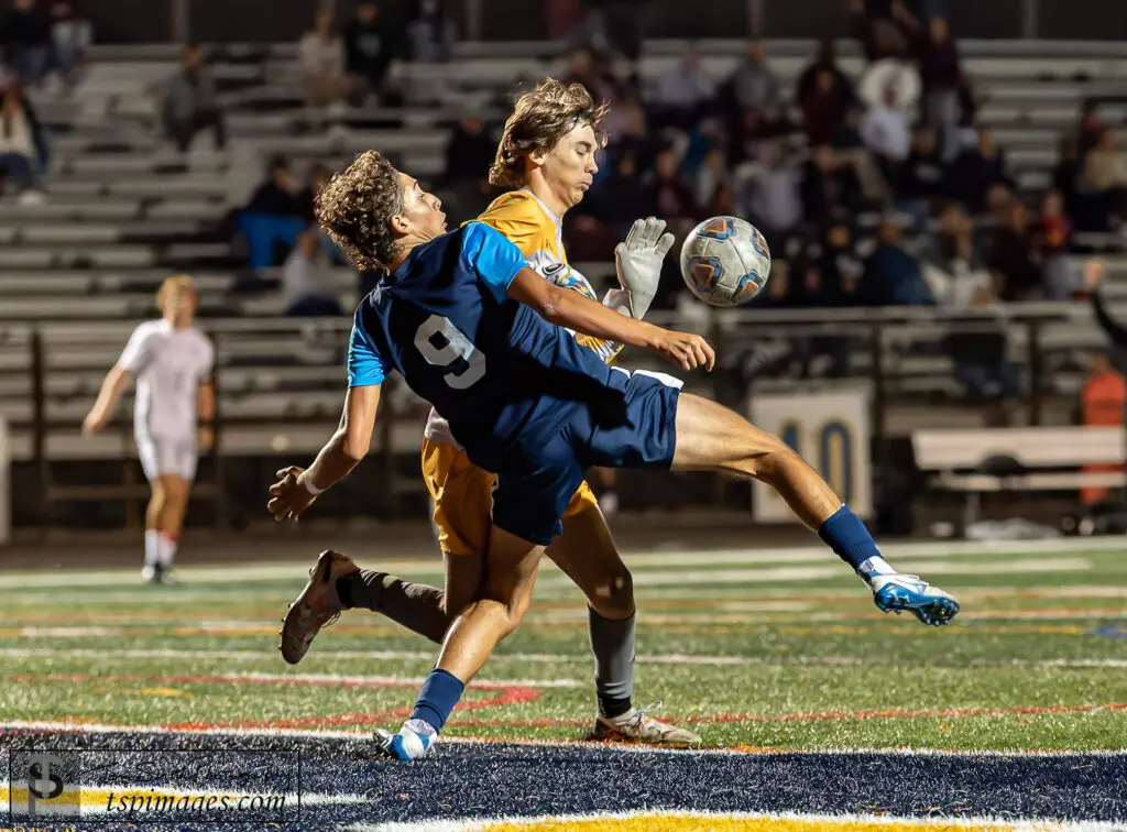 Toms River North vs. Toms River South boys soccer - Shore Sports Insider Toms River North senior Cristian Caso (9) and Toms River South senior goalkeeper Nolen Mahoney compete for a loose ball. (Photo: Tom Smith | tspimages.com) - Toms River North vs. Toms River South boys soccer
