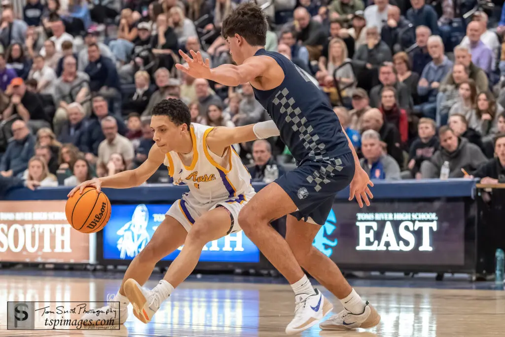 St. Rose Tyler Cameron - Shore Sports Insider St. Rose senior Tyler Cameron guarded by Manasquan junior Logan Cleveland during the 2024-25 season. (Photo: Tom Smith | tspimages.com) - St. Rose Tyler Cameron