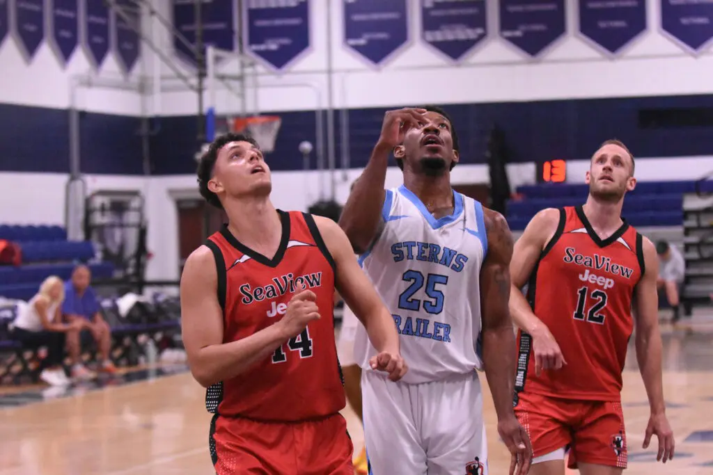 Rice/Dortch - Shore Sports Insider Xander Rice and Parker Dortch battle for a rebound while Roy Mabrey looks on - Rice/Dortch