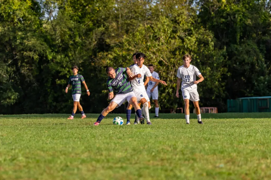 CBA at Colts Neck - Shore Sports Insider Colts Neck senior Tyler Spencer and CBA sophomore Joe Guastella battle for the ball. (Photo: Doug Phillips) - CBA at Colts Neck