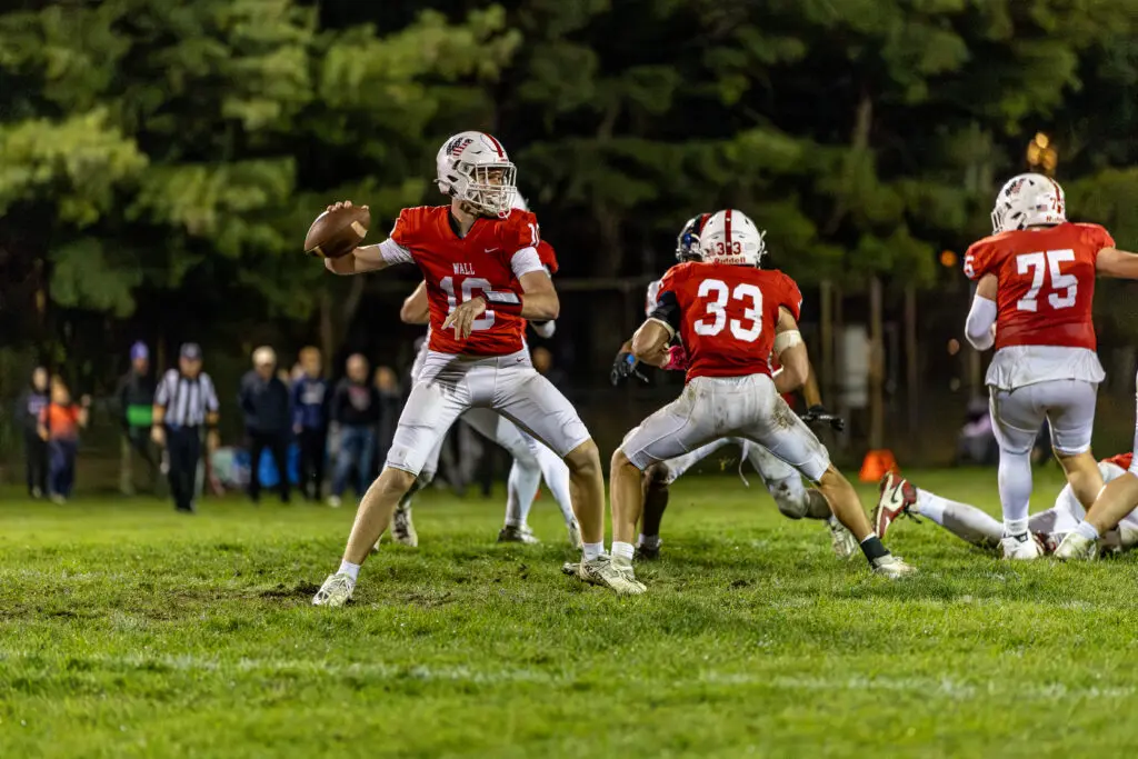 Brian McKenna- Wall - Shore Sports Insider Wall senior quarterback Brian McKenna attempts a pass against Manalapan - Brian McKenna- Wall