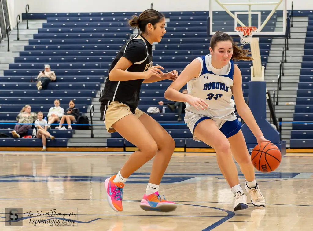 DC Sarah Franks - Shore Sports Insider Donovan Catholic junior Sarah Franks drives the lane as Angela Forese keeps step during the Donavan Catholic vs Pt Pleasant Boro KWCC Christmas Classic at the RWJBarnabas Health Arena in Toms River, . 12/30/25 Photo Credit: Tom Smith | tspsportsimages.com - DC Sarah Franks