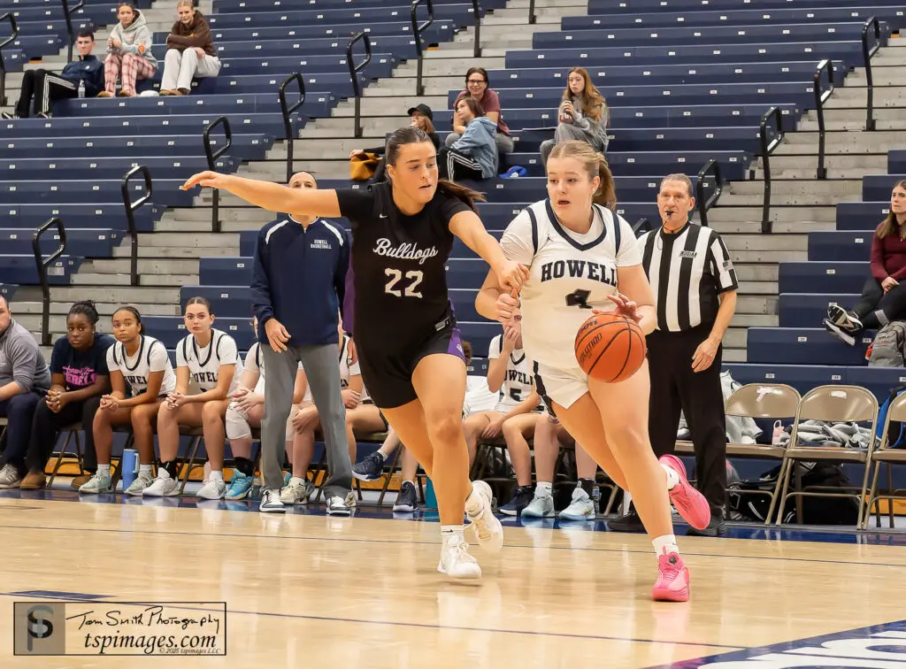 H Kylee Beam 2 - Shore Sports Insider Howell junior Kylee Beam with the step on the baseline as Erin Reid defends during the Rumson Fair Haven vs Howell at the KWCC Christmas Classic at RWJBarnabas Health Arena in Toms River, . 12/30/25 Photo Credit: Tom Smith | - H Kylee Beam 2