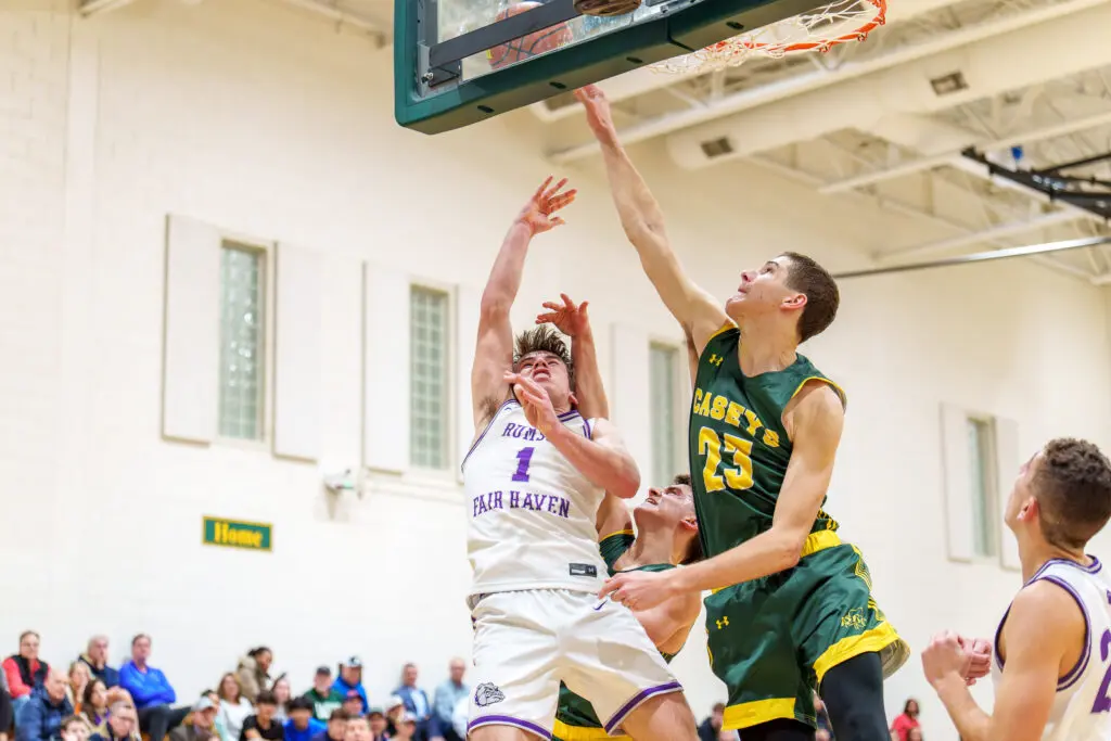 Rumson at RBC - Shore Sports Insider Red Bank Catholic junior Tyler Hager blocks a shot by Rumson-Fair Haven junior Casey Moore. (Photo: Patrick Olivero) - Rumson at RBC