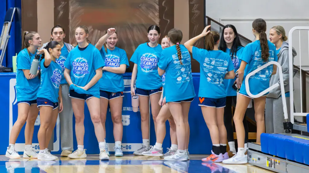 149A0962 - Shore Sports Insider Trinity Hall waiting to warm-up in their Coaches vs Cancer t-shirts. 1/10/26 Photo by @VS_Visuals_ - 149A0962