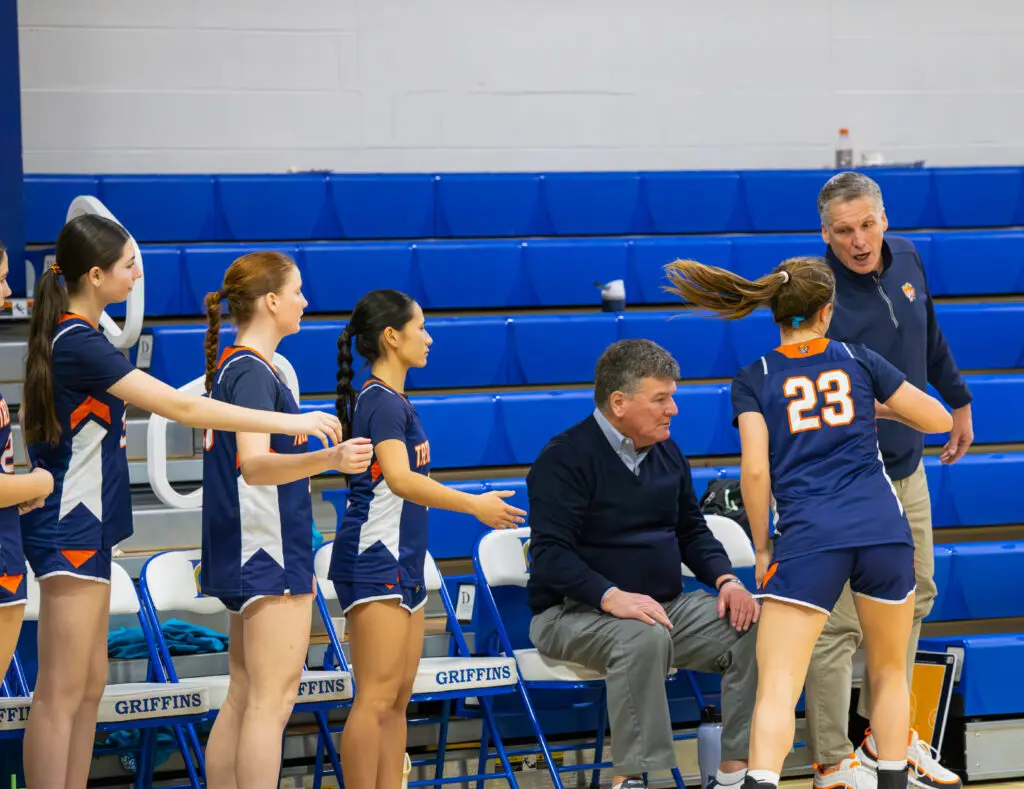 149A1883 - Shore Sports Insider Coach Matt McCarthy with Anna Noble (#23) who provided a spark off the bench for Trinity Hall. 1/10/26. Photo by @VS_Visuals_ - 149A1883