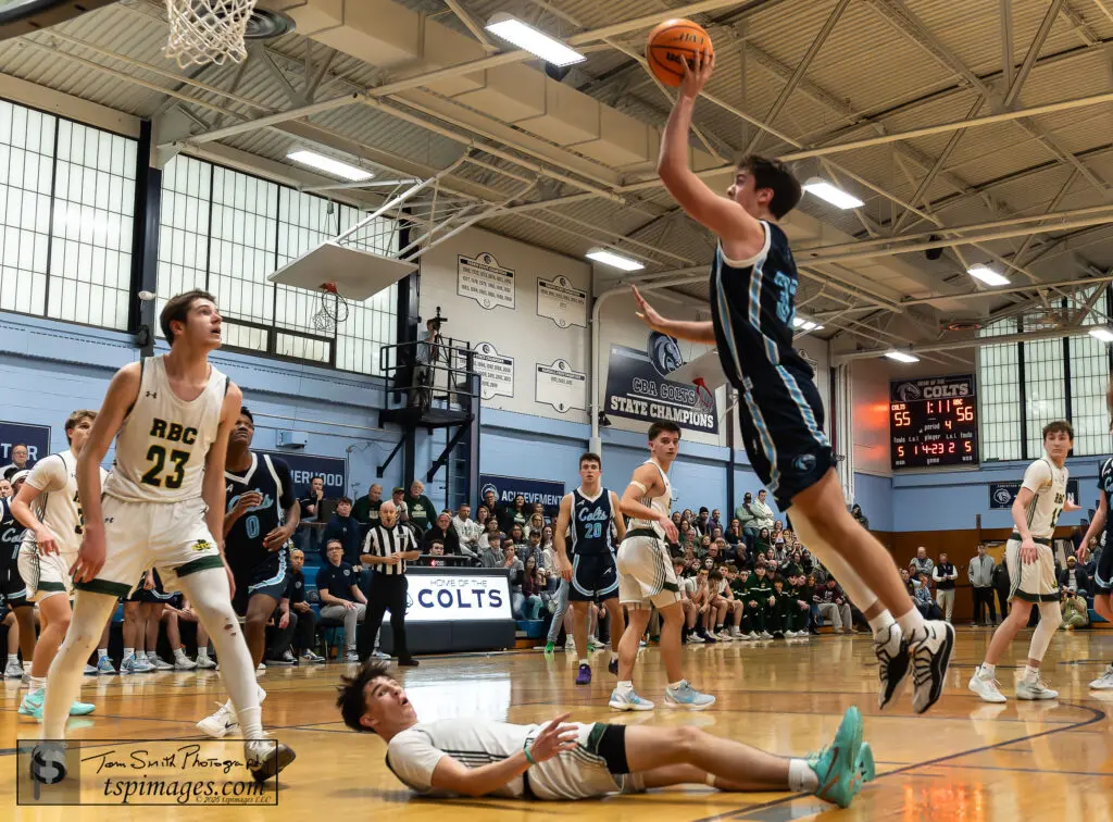 CBA vs RBC - Shore Sports Insider CBA senior Connor Andree takes a shot with Red Bank Catholic senior Ryan Saxton on the ground and RBC junior Tyler Hager (23) looking on. (Photo: Tom Smith | tspsportsimages.com) - CBA vs RBC
