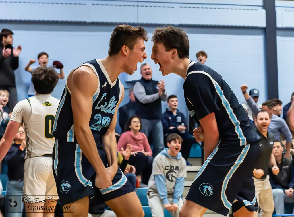 CBA vs RBC - Shore Sports Insider CBA senior Charlie Messano (left) and junior Avery Lynch celebrate the front-end of Messano's three-point play in overtime that helped seal CBA's win over Red Bank Catholic. (Photo: Tom Smith | tspsportsimages.com) - CBA vs RBC