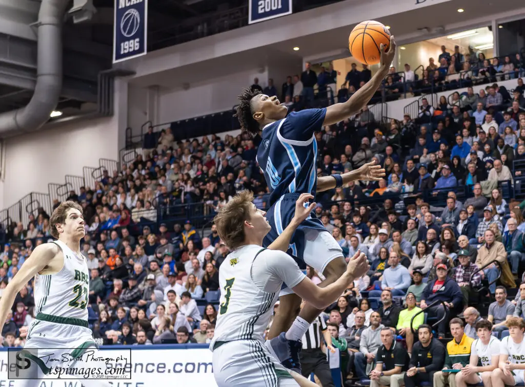 CBA Izayah Cooper-2 - Shore Sports Insider CBA sophomore Izayah Cooper glides to the basket against Red Bank Catholic junior Gavin Biasi. (Photo: Tom Smith | tspsportsimages.com) - CBA Izayah Cooper-2