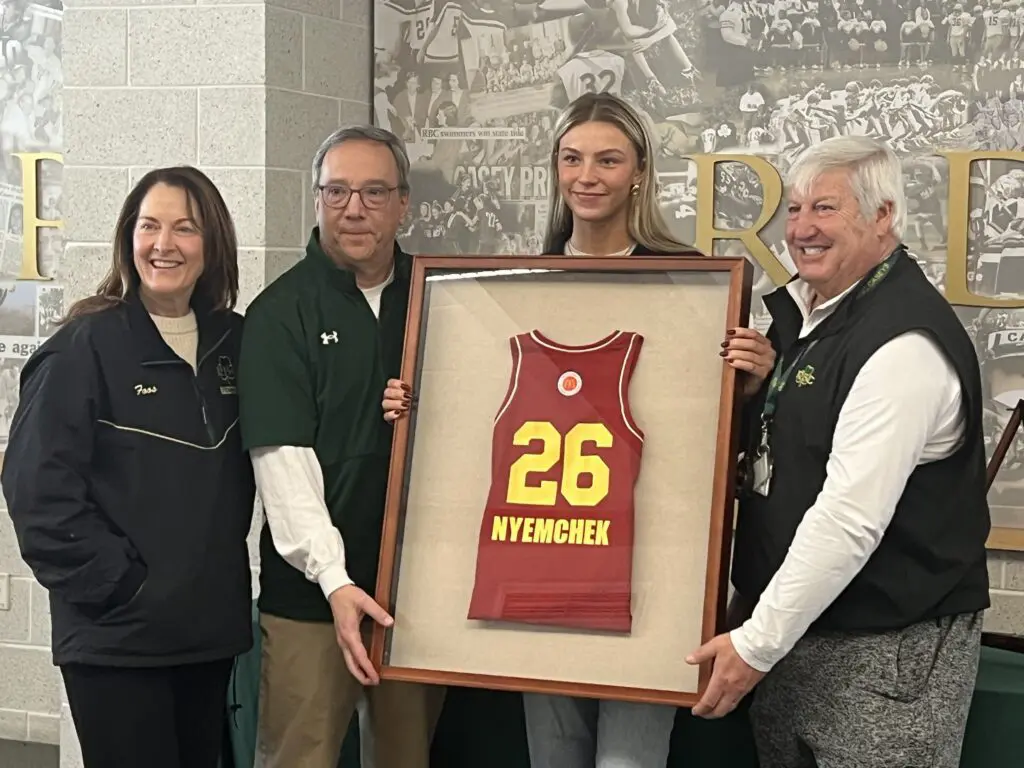 Nyemchek All-American - Shore Sports Insider Addy Nyemchek with her McDonald's All-American jersey and coaches. From left: Assistant Kathy Foos, head coach Joe Montano, assistant Joe Pingitore. (Photo: Matt Manley) - Nyemchek All-American