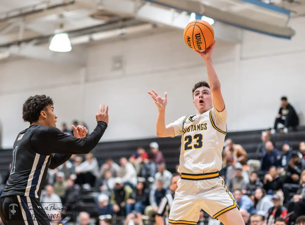 Marlboro Dylan McEwan - Shore Sports Insider Marlboro junior Dylan McEwan puts up a shot over Howell senior Cayden Parker. (Photo: Tom Smith | tspsportsimages.com) - Marlboro Dylan McEwan
