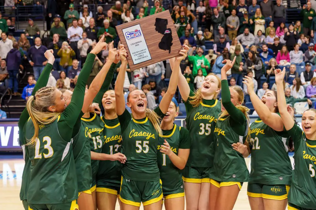 RBC SCT Champs - Shore Sports Insider Red Bank Catholic's Addy Nyemchek (55) raises the Shore Conference Tournament championship plaque. (Photo: Patrick Olivero) - RBC SCT Champs
