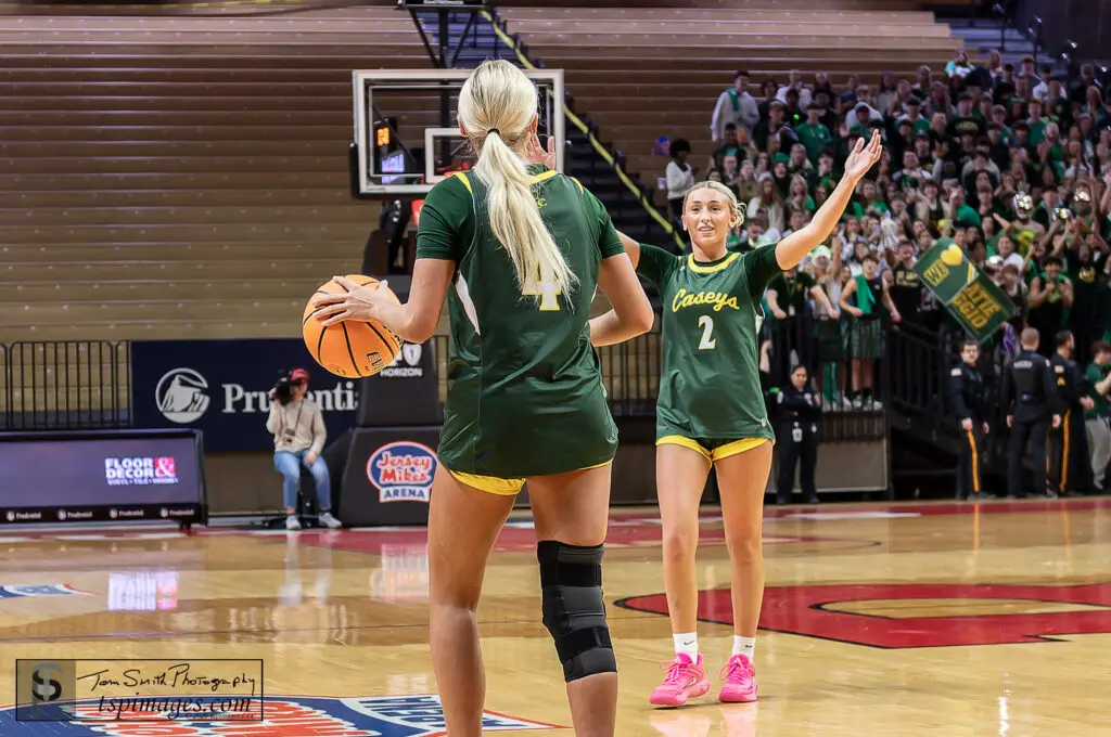 RBC Tessa and Katie Liggio - Shore Sports Insider Red Bank Catholic senior Katie Liggio dribbles out the clock on RBC's Non-Public A championship victory as sister Tessa Liggio prepares to celebrate. (Photo: Tom Smith | tspsportsimages.com) - RBC Tessa and Katie Liggio