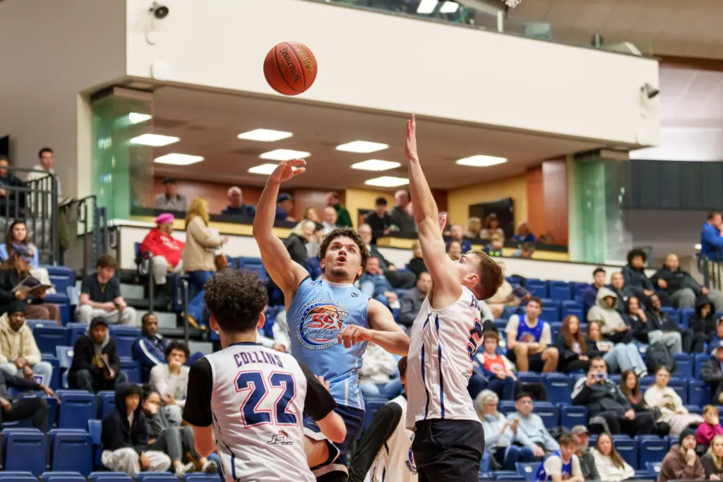 Senior All-Star Game Mike Cush - Shore Sports Insider Freehold Boro's Mike Cush puts up a shot over Brick Memorial's Sean Collins and Point Beach's Jacob Edgecomb. (Photo: Patrick Olivero) - Senior All-Star Game Mike Cush
