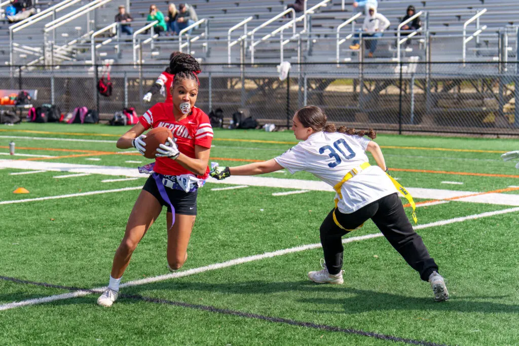 Neptune Lana Ellington - Shore Sports Insider Neptune's Lana Ellington attempts to dodge a flag pull (Photo by Patrick Olivero) - Neptune Lana Ellington