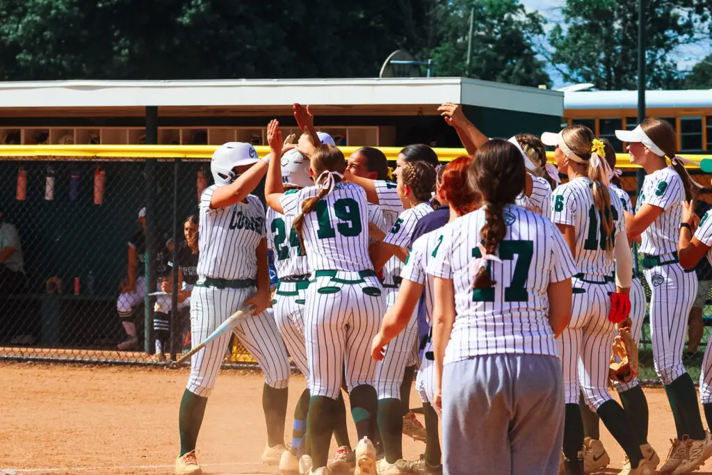 Sasso HR Celebration - Shore Sports Insider Colts Neck celebrates Angela Sasso's first inning home run (Photo by SidelineSamsShots) - Sasso HR Celebration