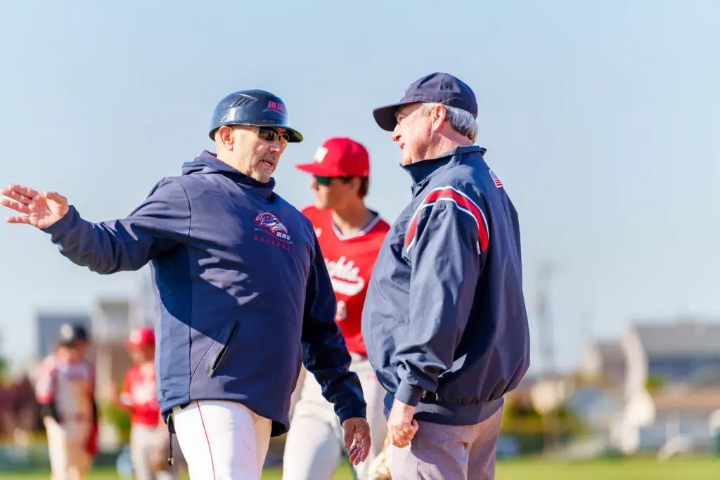 Wall at Point Beach - Shore Sports Insider Point Beach coach Angelo Fiore speaks with an umpire during his team's home game vs. Wall. (Photo: Patrick Olivero) - Wall at Point Beach
