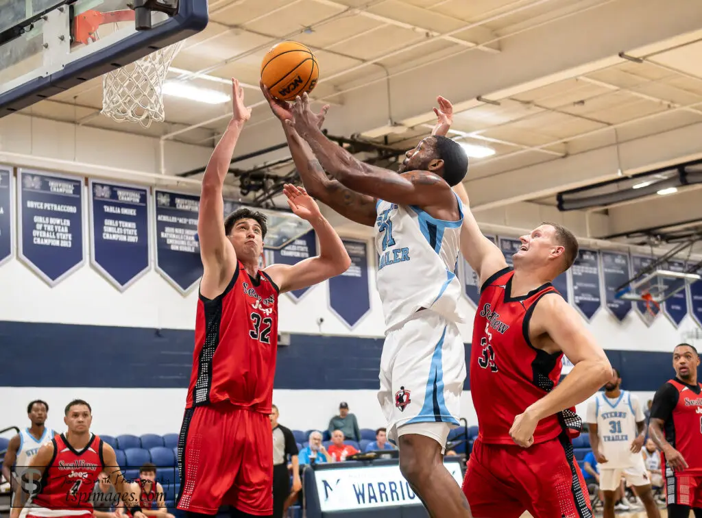 Parker Dortch JSBL - Shore Sports Insider Parker Dortch of Stern's Trailer goes up between Josh Cohen (left) and Emmett Hall of Sea View Jeep during the semifinals of the 2026 JSBL Playoffs at Manasquan High School. (Photo: Tom Smith | tspsportsimages.com) - Parker Dortch JSBL