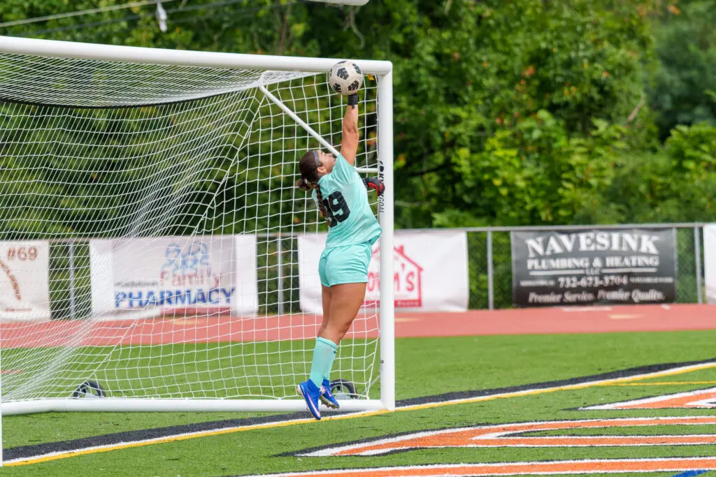 MSJuliannaFiore1 - Shore Sports Insider Julianna Fiore saves a free kick against Middletown North. 9/19/26 (Photo by Patrick Olivero) - MSJuliannaFiore1