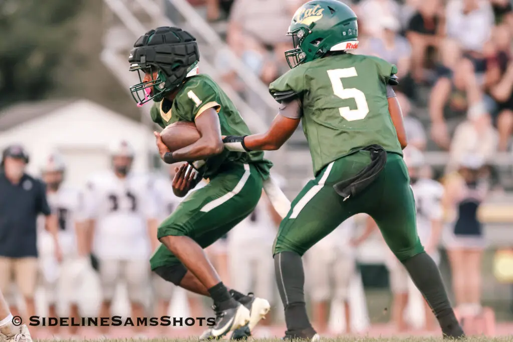 Pinelands RJ Clark - Shore Sports Insider Pinelands running back RJ Clark receives a handoff (Photo by SidelineSamsShots) - Pinelands RJ Clark