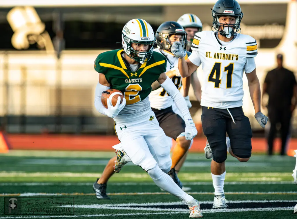 RBC Mikey O'Neal - Shore Sports Insider Red Bank Catholic kick returner Mikey O'Neal (Photo: Tom Smith | tspsportsimages.com) - RBC Mikey O'Neal's jersey chased by a teammate in white St. Anthony's jersey #41.
