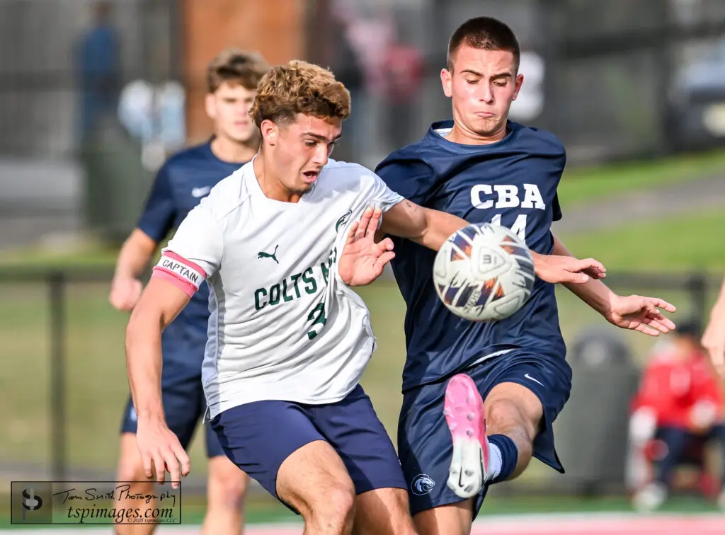CBA Romeo Guido and Colts Neck Sean Moore - Shore Sports Insider Colts Neck senior Sean Moore (left) battles for the ball with CBA junior Romeo Guida. (Photo: Tom Smith | tspsportsimages.com) - CBA Romeo Guido and Colts Neck Sean Moore