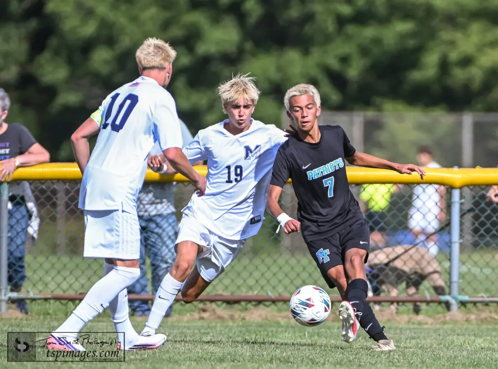 Freehold Twp Jack Manfredonia - Shore Sports Insider Freehold Township junior Jack Manfredonia attempts to shake Manasquan senior Maceo Manno. (Photo: Tom Smith | tspsportsimages.com) - Freehold Twp Jack Manfredonia