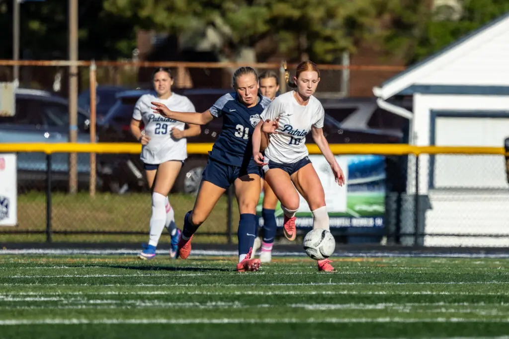 Lee_Memmolo - Shore Sports Insider Nora Lee (right) and Makenzie Memmolo (left) battling for control in the SCT 2nd Round at Howell High School. 10/15/26 (Photo by Doug Phillips/Framegrabs LLC) - Lee_Memmolo
