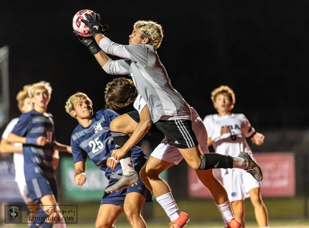 Manasquan GK Quinn Petrulla - Shore Sports Insider Manasquan senior goalkeeper Quinn Petrulla punches a ball away. (Photo: Tom Smith | tspsportsimages.com) - Manasquan GK Quinn Petrulla