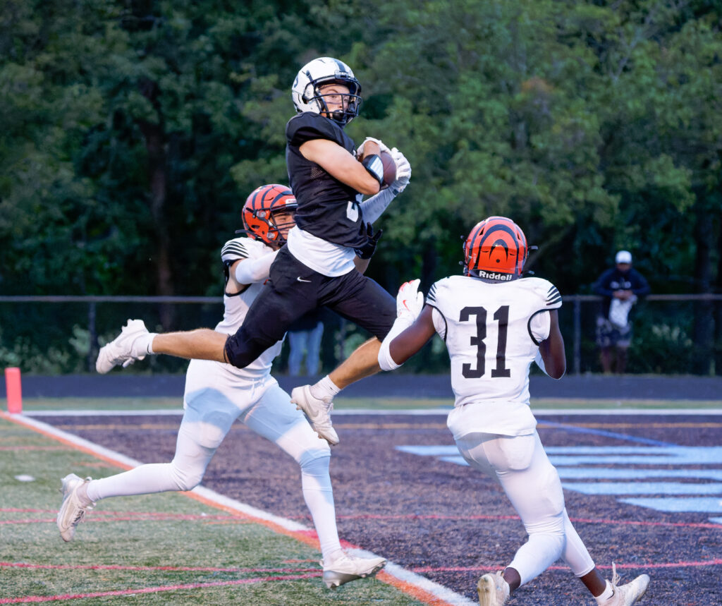 Senior wide receive Dylan Errion snagged a go-ahead 26-yard touchdown pass from senior quarterback Anthony Demarco to lift the Raiders to a 12-7 win over Barnegat on opening day. (Bob Badders | rpbphotography.com) - Dylan Errion, Toms River East football