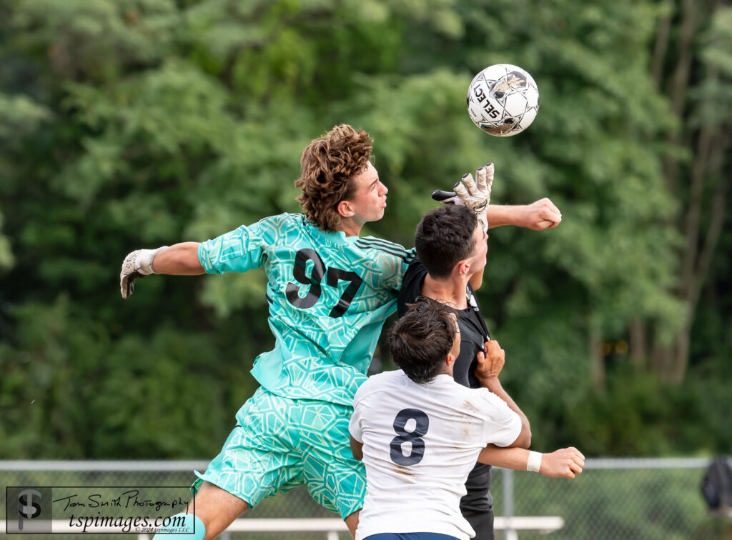 Manalapan goalkeeper Chase Lee (97) and teammate Ethan Dass (8) battle Middletown North's Christos Dounis. (Photo: Tom Smith | tspimages.com) - Midd North vs Manalapan-9