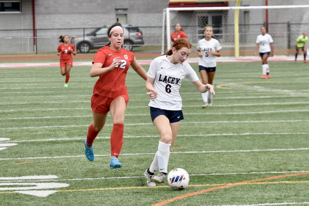 Junior defender Danielle Pasqua attacks Ocean's defense. (Photo by Eric Braun) - Lacey Danielle Pasqua