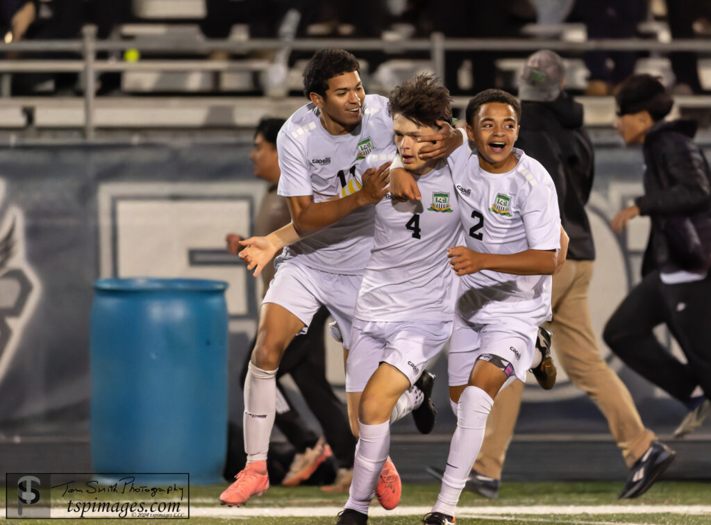 From left, Johan Gomez, Evan Santiago and Jordan Vieira celebrate Long Branch's first goal against Middletown South. (Photo: Tom Smith | tspimages.com) - Long Branch at Midd South