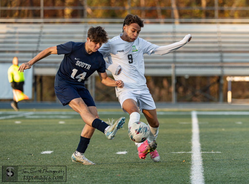 Long Branch junior Thomas Silva holds off Middletown South's Ryan Kapler. (Photo: Tom Smith | tspimages.com) - LB Thomas Silva