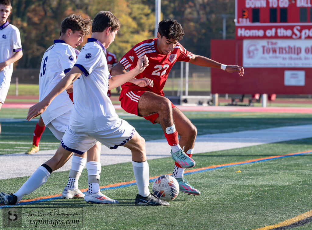 Ocean seniro Noor Eraky cornered by Rumson-Fair Haven defenders. (Photo: Tom Smith | tspimages.com) - Rumson at Ocean