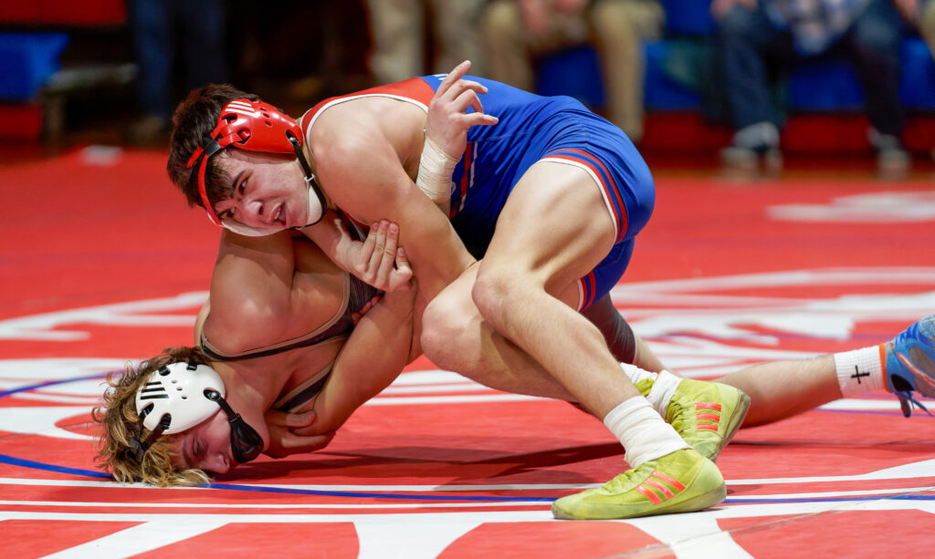 Ocean Township's Michael "Boomer" Volek wrestles Brick Memorial's Jack Torre at 144 pounds during a dual between the Spartans and Mustangs on Jan. 25, 2024. (Bob Badders | rpbphotography.com) 