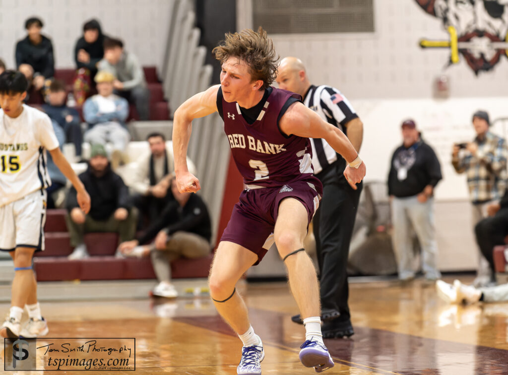 Red Bank senior Ryan Fisher pumps his fist after hitting a three-pointer vs. Marlboro. (Photo: Tom Smith | tspimages.com) - RBR vs Marlboro