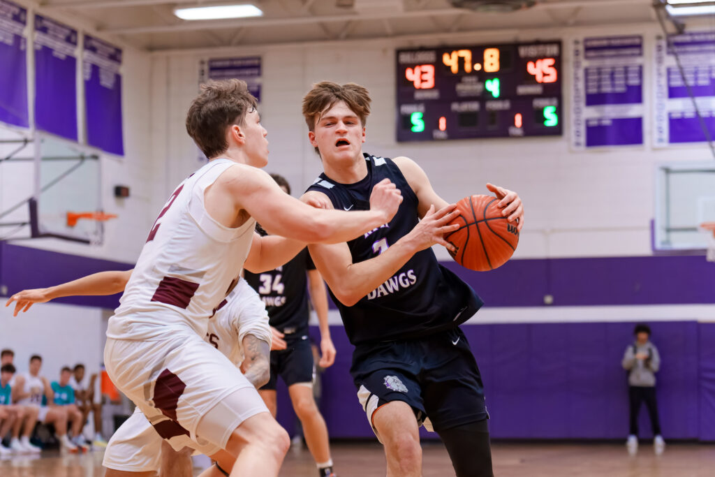 Rumson-Fair Haven senior David Carr drives on Red Bank senior Anthony Moore. (Photo: Patrick Oliveira) - Red Bank at Rumson