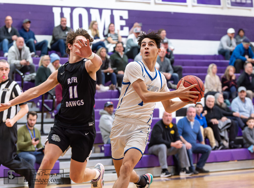 Holmdel senior C.J. Karis drives on Rumson-Fair Haven junior Nic Economou. (Photo: Tom Smith | tspimages.com) - Holmdel CJ Karis