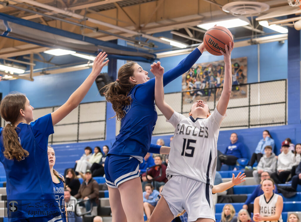 Mackenzie Teevan blocks a shot against Middletown South on  1/23/25. Photo by Tom Smith - Teevan