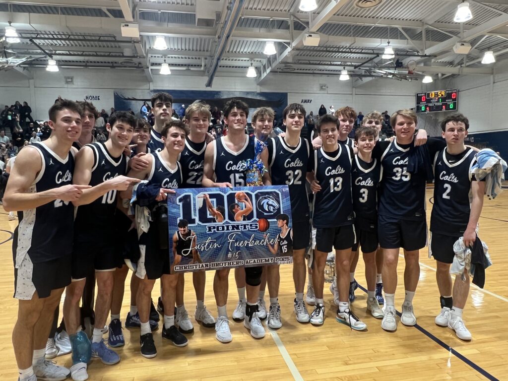 Justin Fuerbacher celebrates his 1,000th career point withhis CBA teammates after beating Holmdel in the Shore Conference Tournament quarterfinals. (Photo: Matt Manley) - Justin Fuerbacher 1000