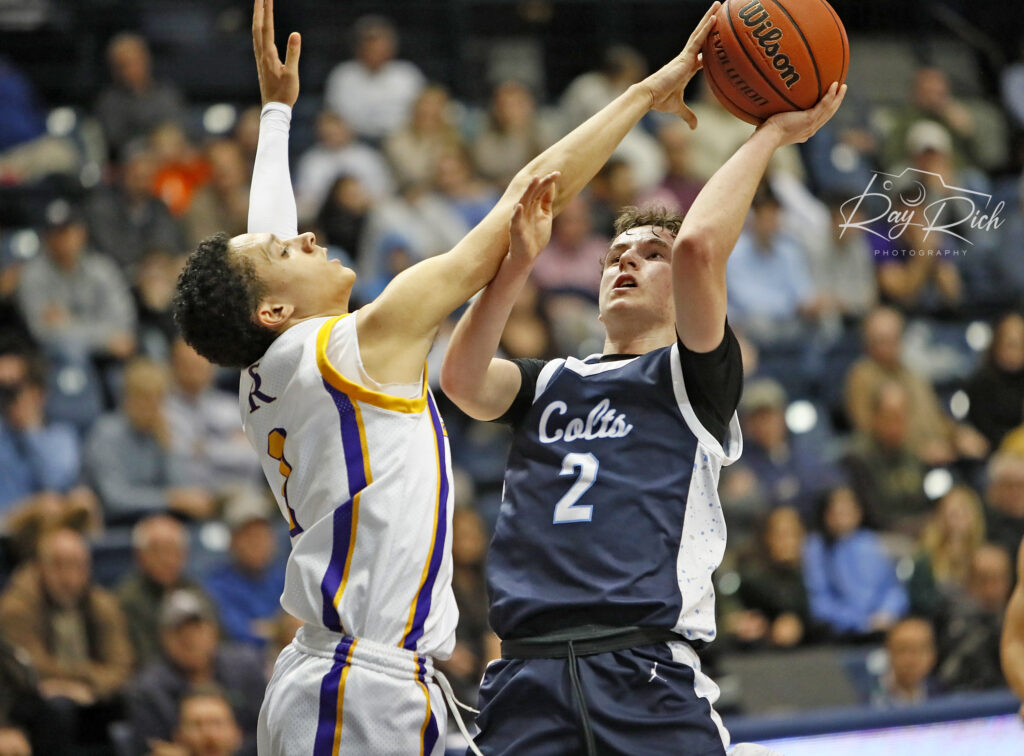 St. Rose junior Tyler Cameron challenges a shot by CBA junior Charlie Marcoullier. (Photo: Ray Rich Photography) - St. Rose vs. CBA