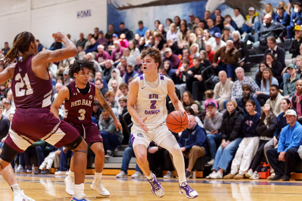 Rumson senior David Carr watched by Red Bank senior Zayier Dean. (Photo: Patrick Oliveira) - RFH vs Red Bank SCT