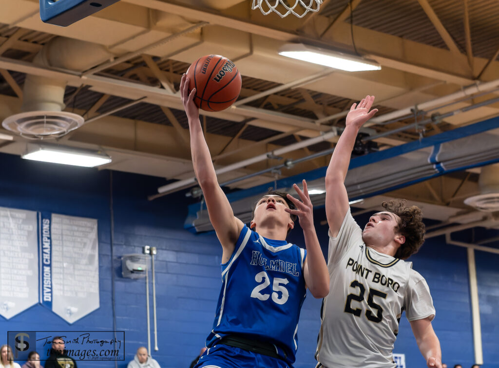 Holmdel freshman Anthony Serini drives against Point Boro senior Drew Cardia. (Photo: Tom Smith | tspimages.com) - Holmdel Anthony Serini