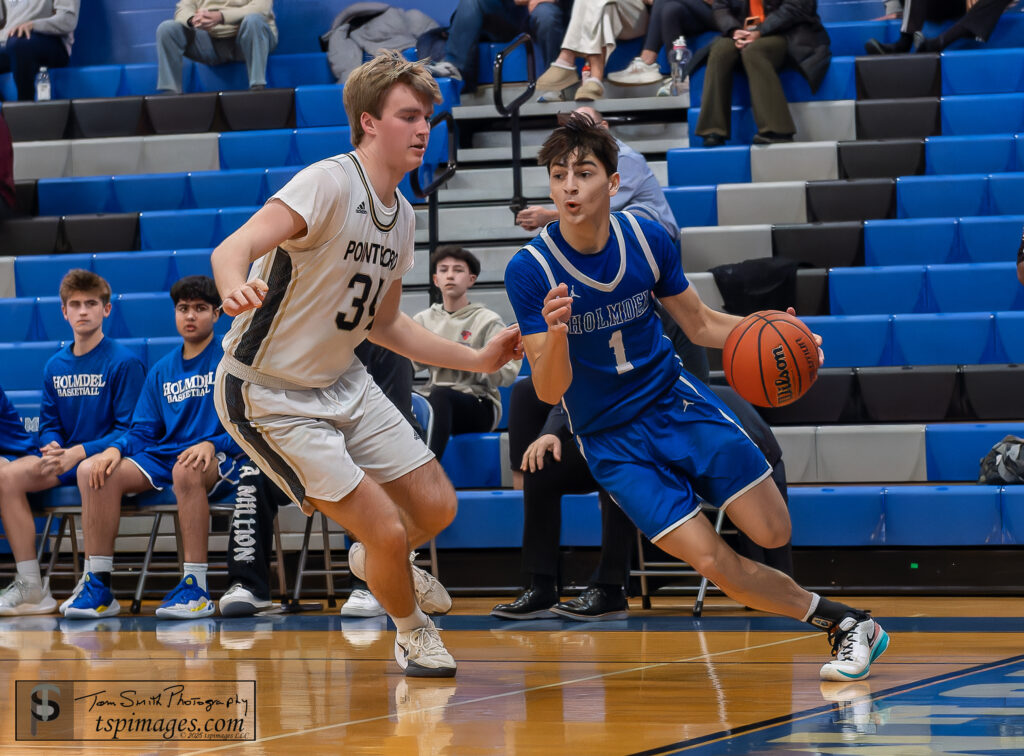 Holmdel senior C.J. Karis drives against Point Boro senior Nick Kowalewski. (Photo: Tom Smith | tspimages.com) - Holmdel CJ Karis