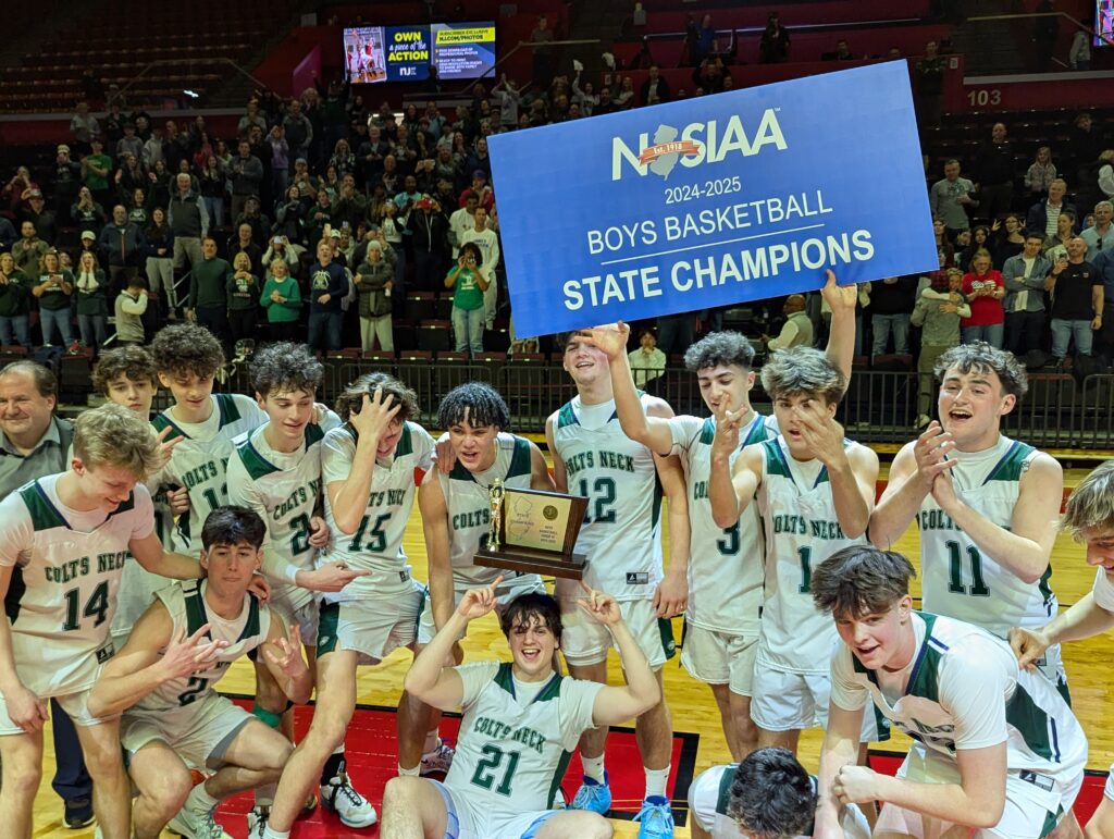 Colts Neck celebrates its first NJSIAA Group title after beating Ramapo 54-46 in the Group 3 championship game. (Photo by Scott Stump)  - Colts Neck championship