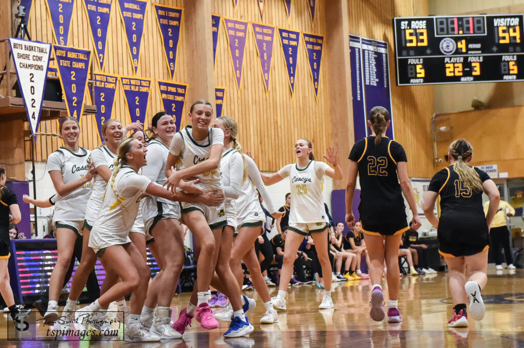 Red Bank Catholic teammates mob Addy Nyemchek she hit the go-ahead free throw with 1.1 seconds left at St. Rose. (Photo: Tom Smith | tspimages.com) - RBC at St. Rose