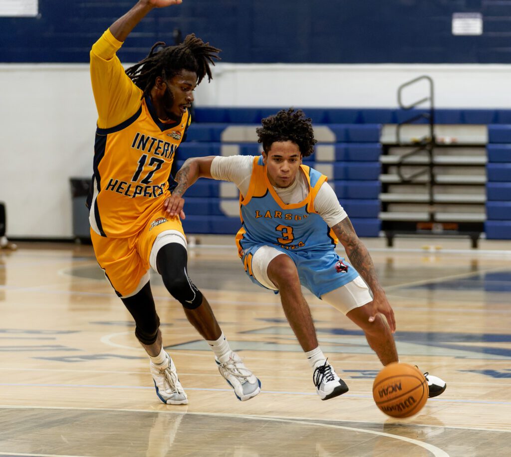 Intern Helpers' Leon Daniels plays defense (Bob Badders | rpbphotography.com) - Leon Daniels