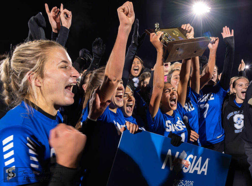 Shore vs Verona-19 - Shore Sports Insider Jenna Eichenbaum lifting the Group 1 Championship Trophy after Shore defeated Verona 2-1. 11/23/25 Photo by Tom Smith - Shore vs Verona-19