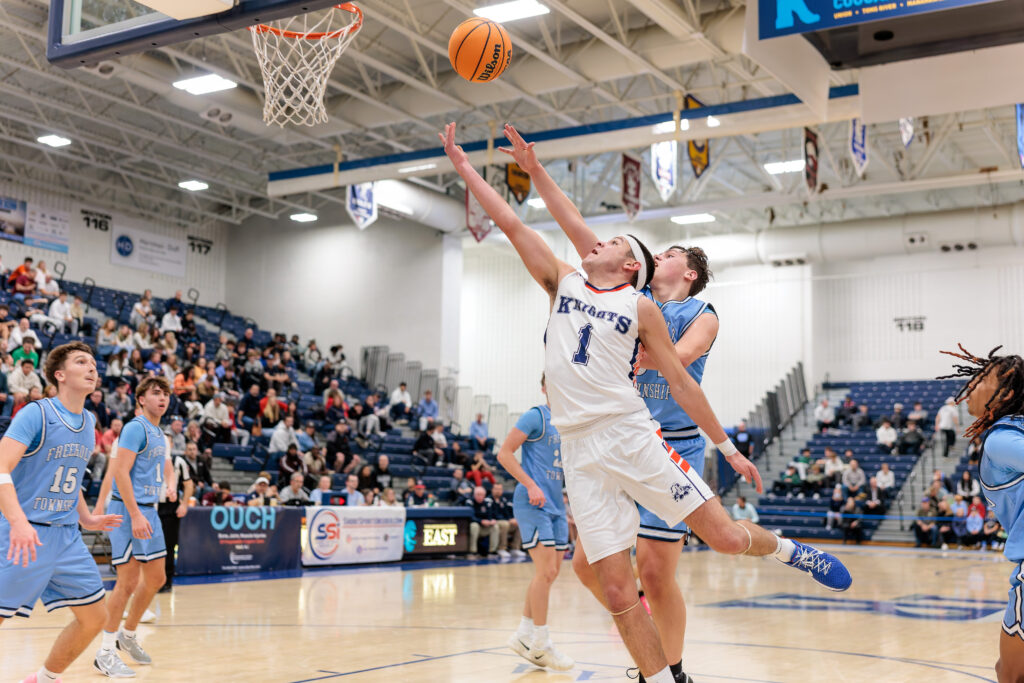 Wall vs. Freehold Twp. - Shore Sports Insider Wall senior Jake DeBrito flips up a layup attempt vs. Freehold Township in the Kevin Williams Christmas Classic final. (Photo: Patrick Olivero) - Wall vs. Freehold Twp.